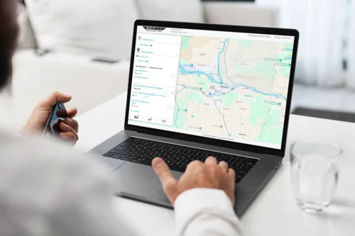 Person booking a courier on their laptop
